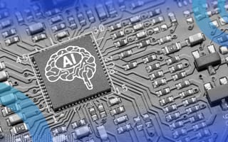 A microchip with an image of a brain and the word “AI” on it in a larger hardware system.